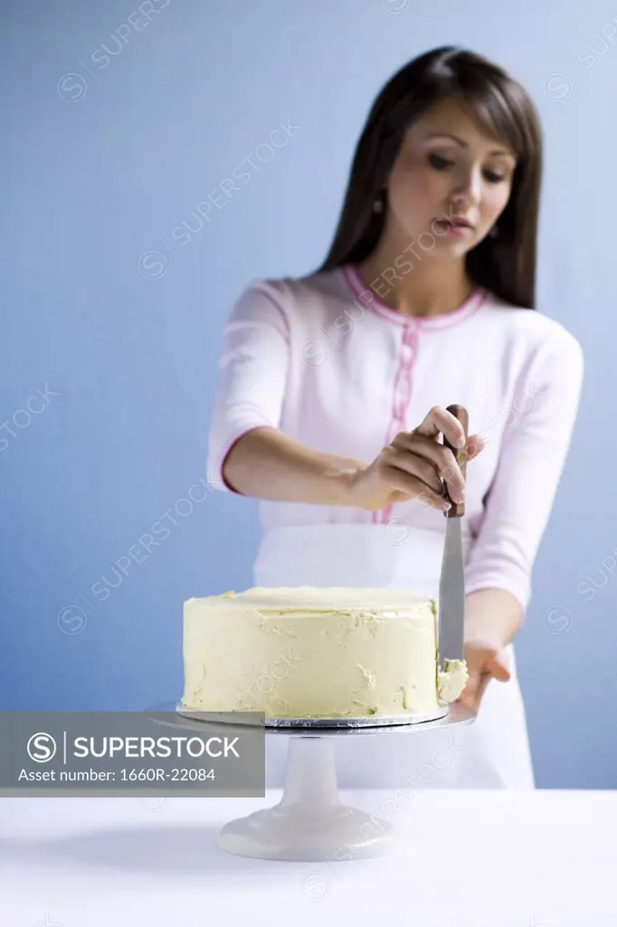 Young woman with a cake.