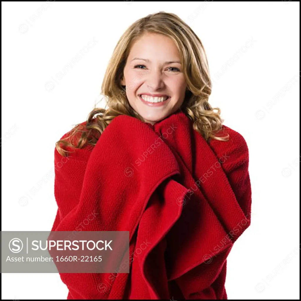 young woman wrapped in a blanket.