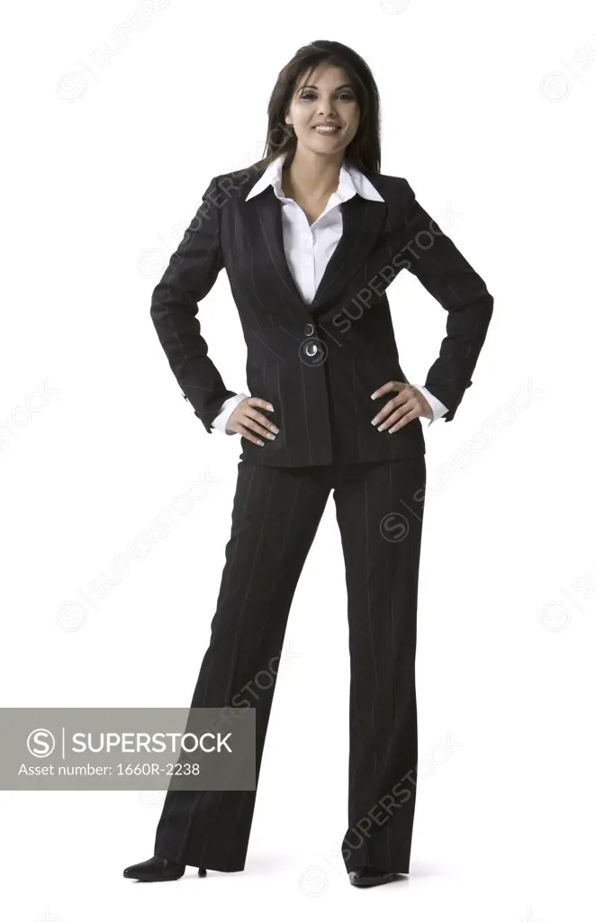 Portrait of a businesswoman standing with arms akimbo