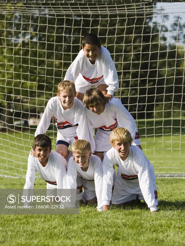 human pyramid of young soccer players
