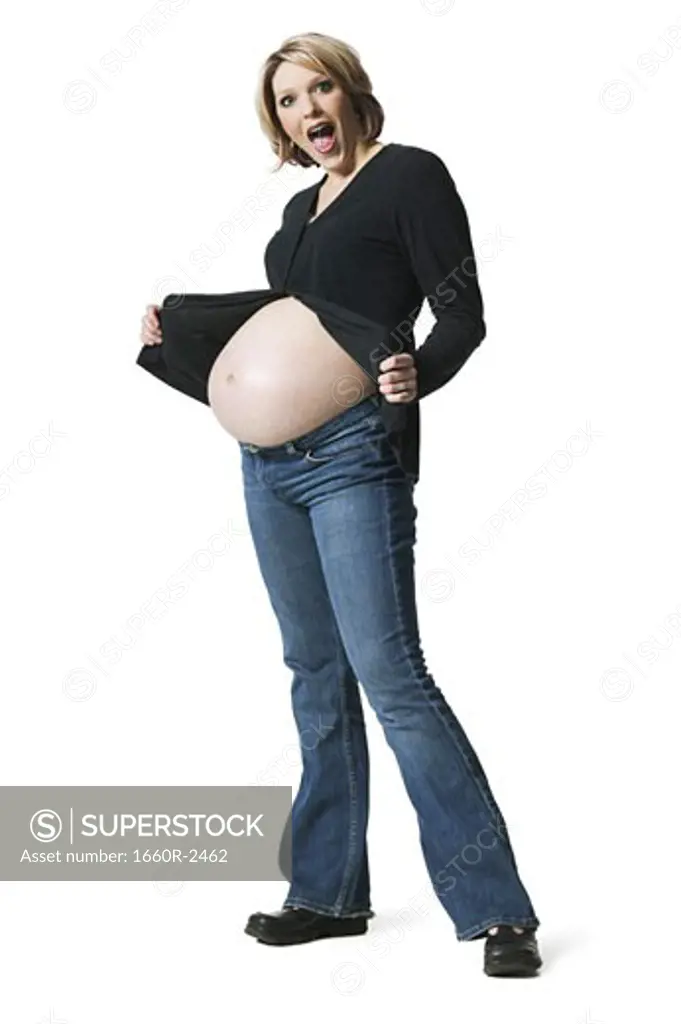Side profile of a pregnant woman showing her stomach