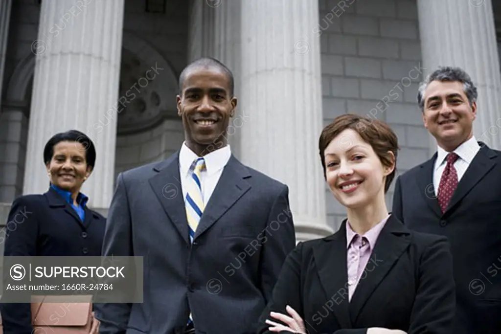 Portrait of lawyers in front of a courthouse