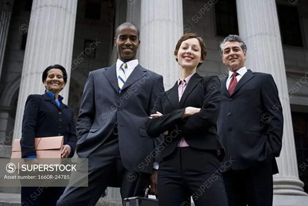 Low angle view of lawyers in front of a courthouse