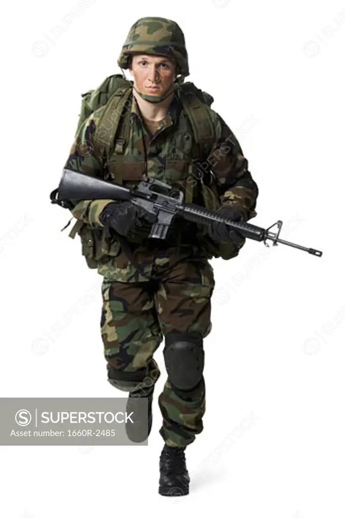 Portrait of a soldier walking with a rifle