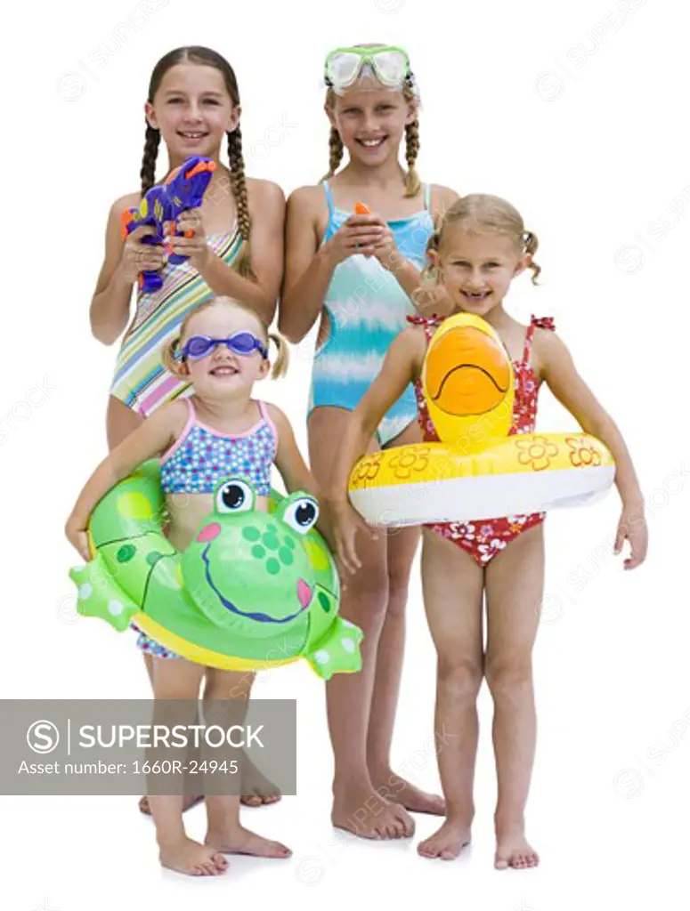 Young sisters in swimsuits on vacation