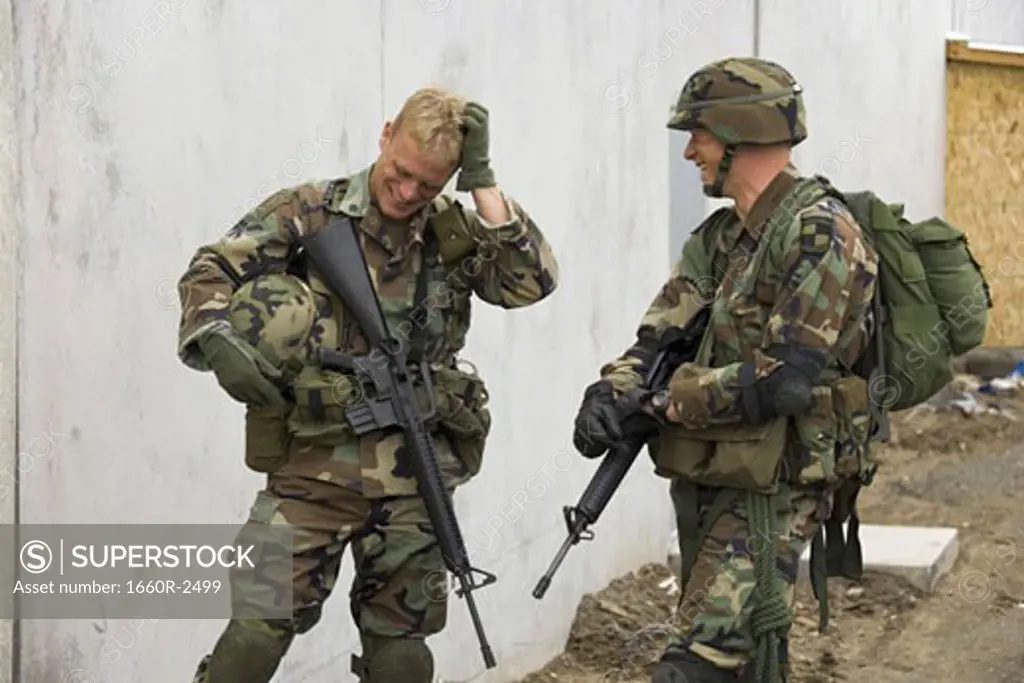 Two soldiers talking to each other