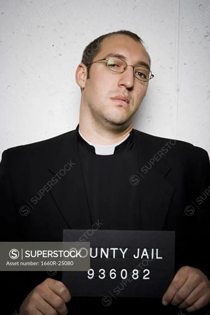 Mug shot of priest with glasses