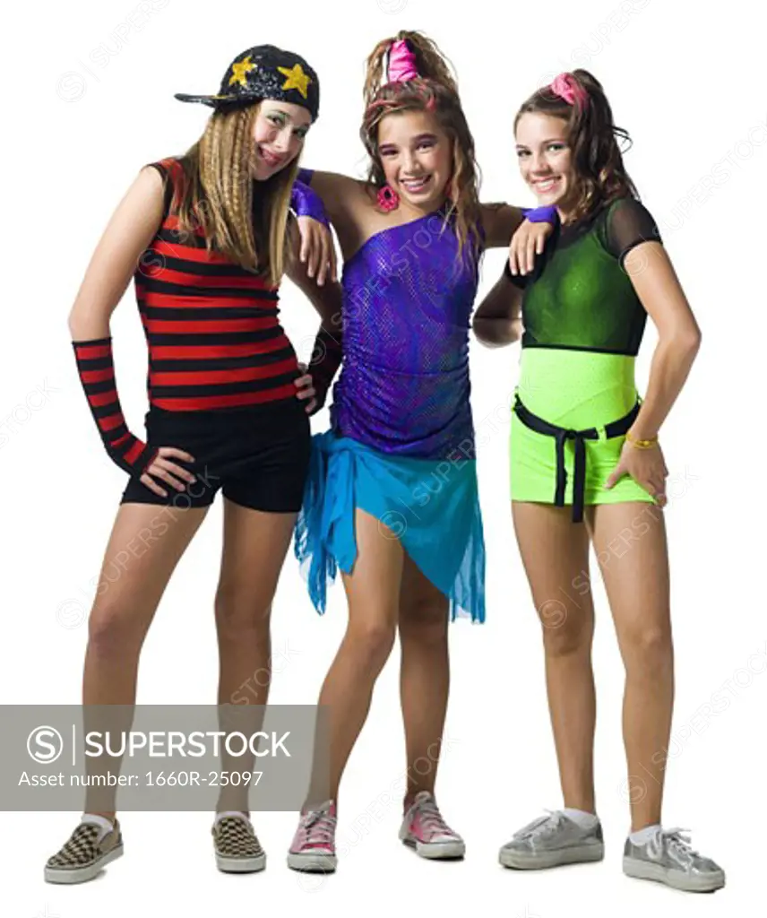 Three girls posing with costumes