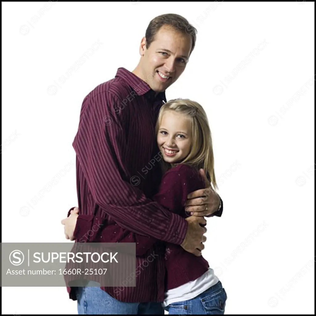 Man embracing girl
