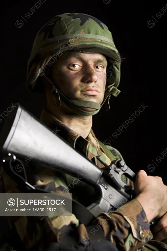 Portrait of a soldier holding a rifle