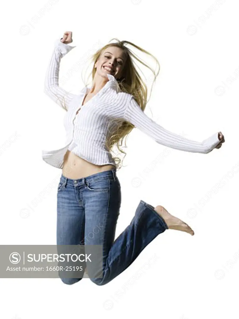 Woman leaping and smiling