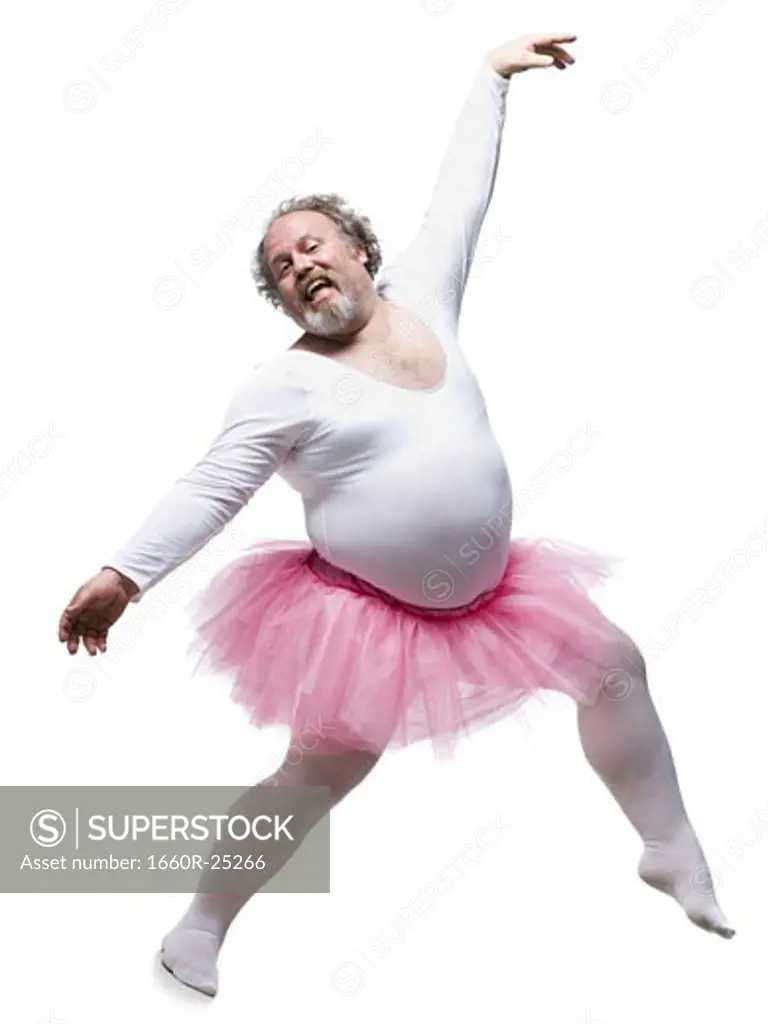 Overweight man in ballerina tutu smiling and dancing