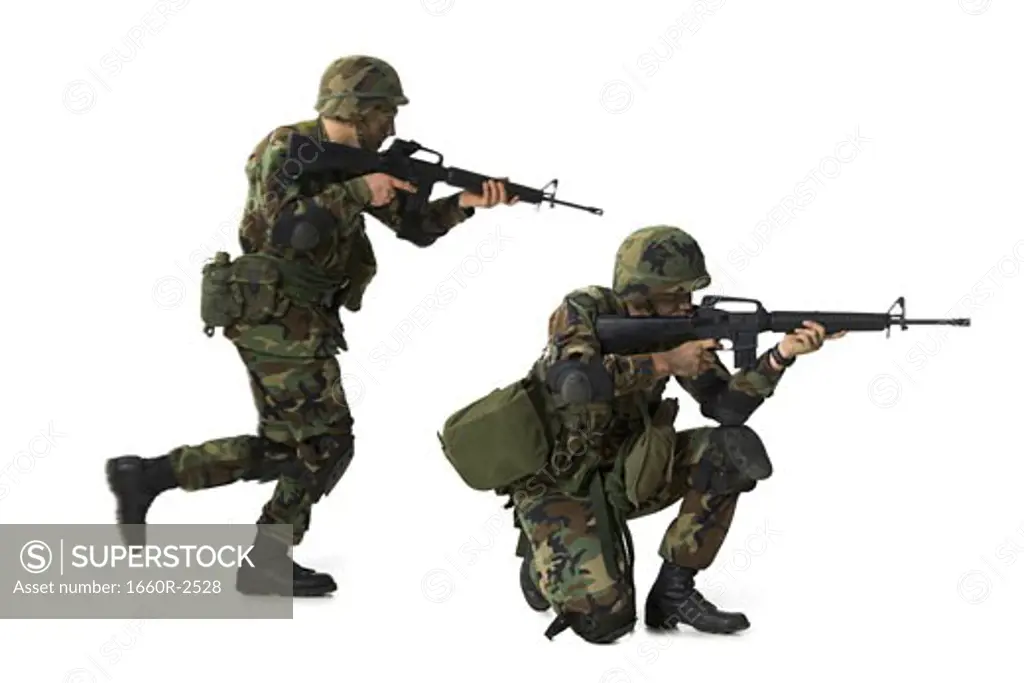 Side profile of two soldiers aiming their rifles