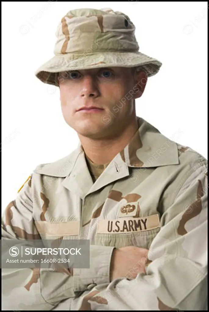 Portrait of a soldier standing with his arms folded