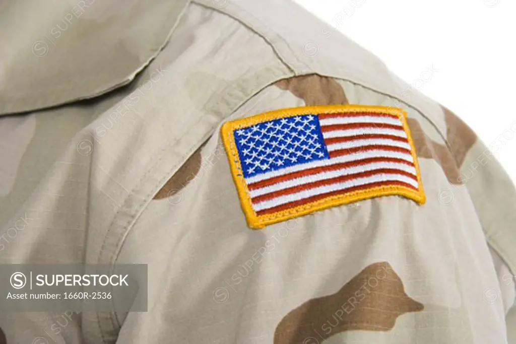 Close-up of a patch of an American flag on soldier's uniform