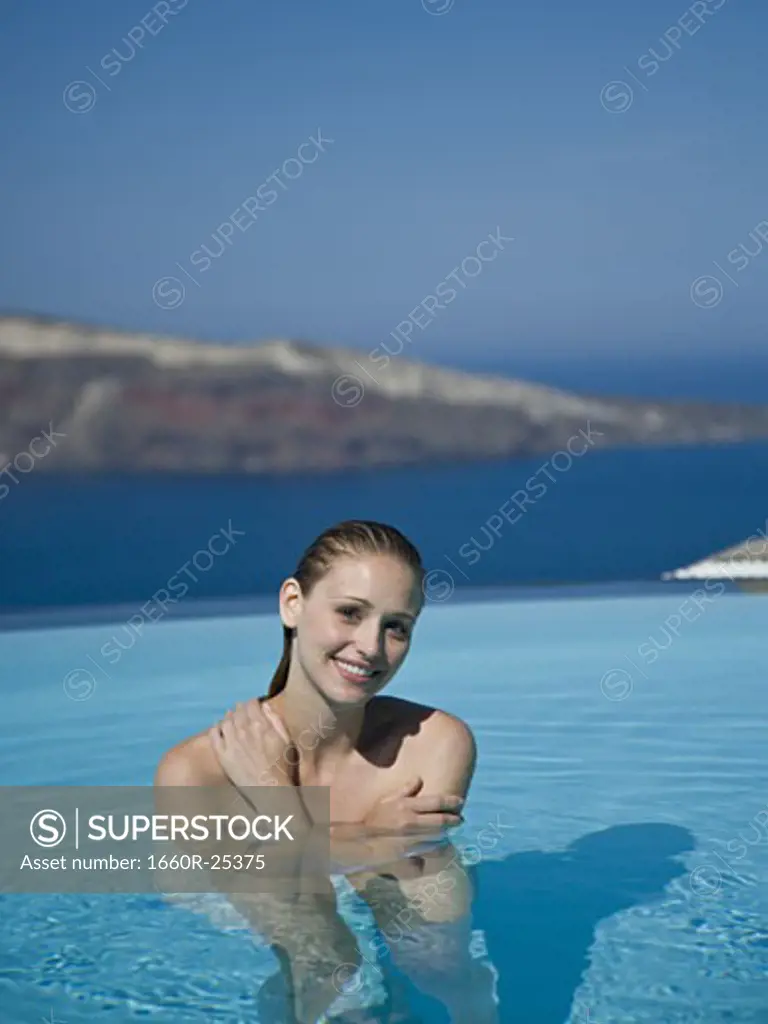 Woman in pool smiling