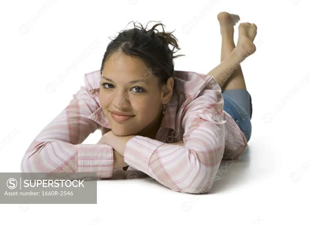 Portrait of a teenage girl resting her chin on her hand
