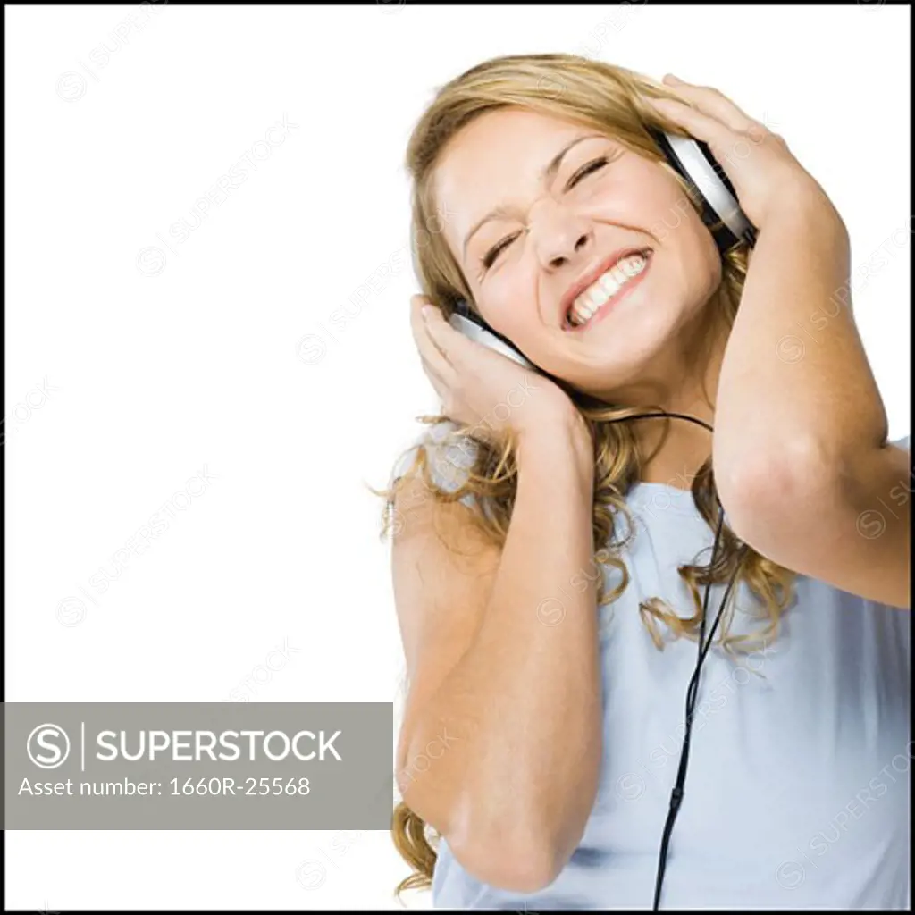 young woman listening to earphones.