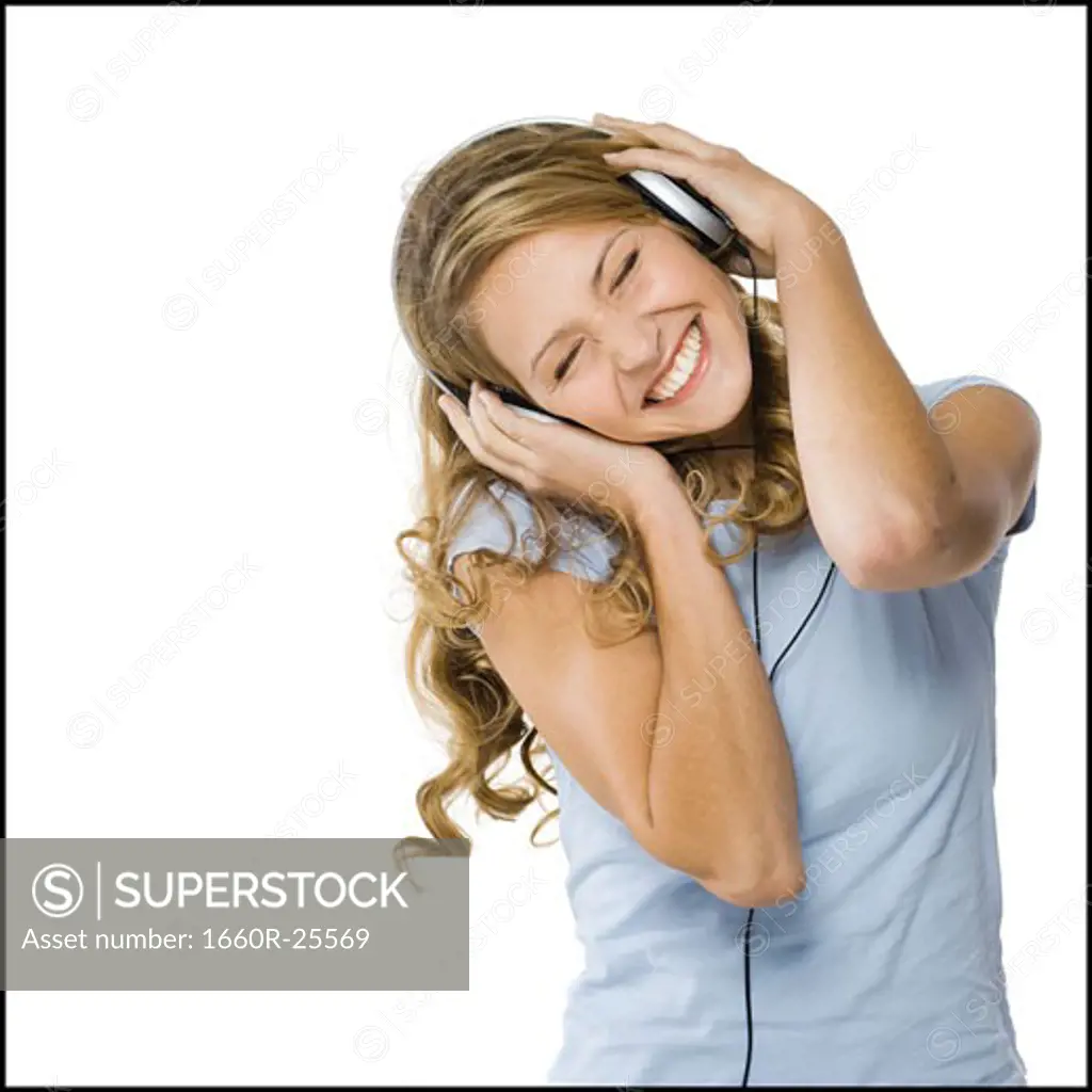 young woman listening to earphones.