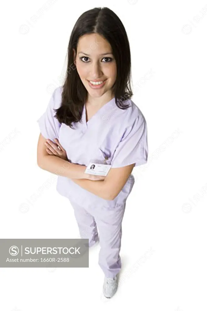 High angle view of a female nurse standing with her arms folded