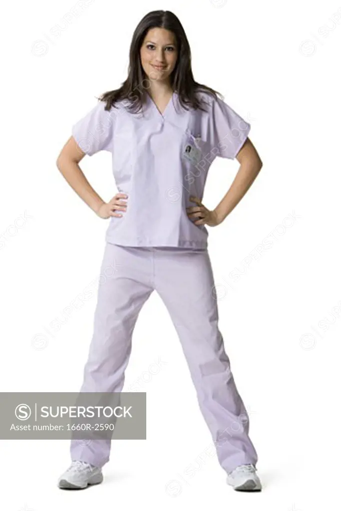 Portrait of a female nurse standing with arms akimbo
