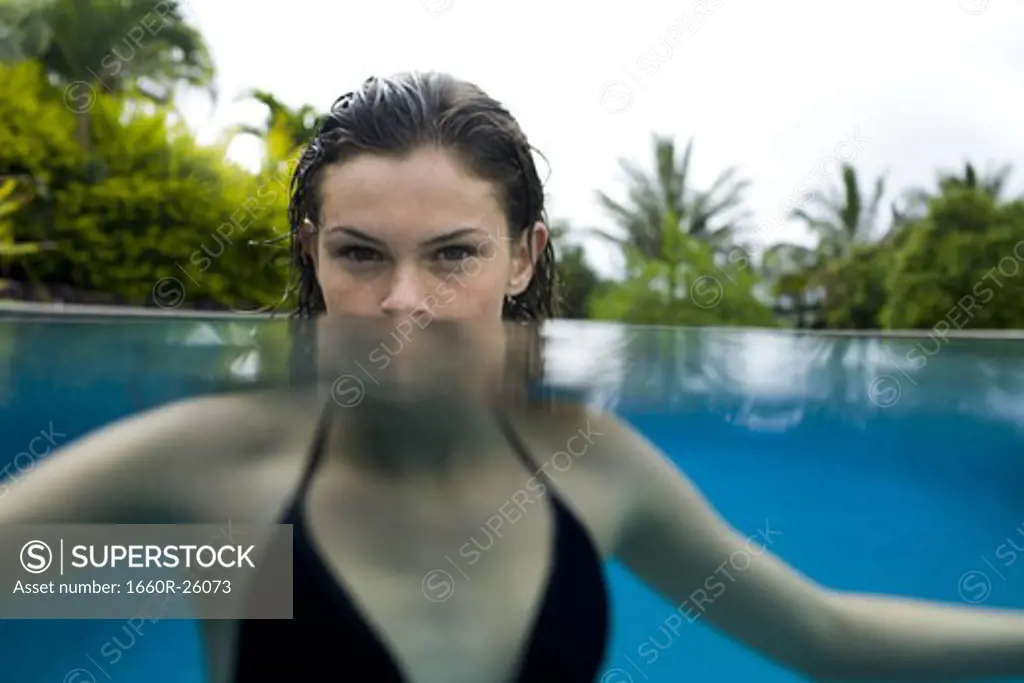 Portrait of a teenage girl in a swimming pool