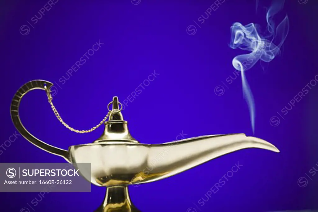 Close-up of a magic lamp emitting smoke