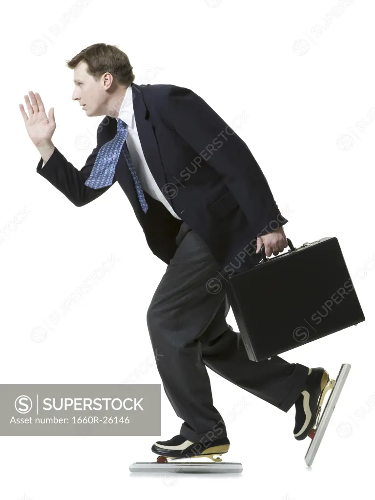 Profile of a businessman ice-skating and holding a briefcase