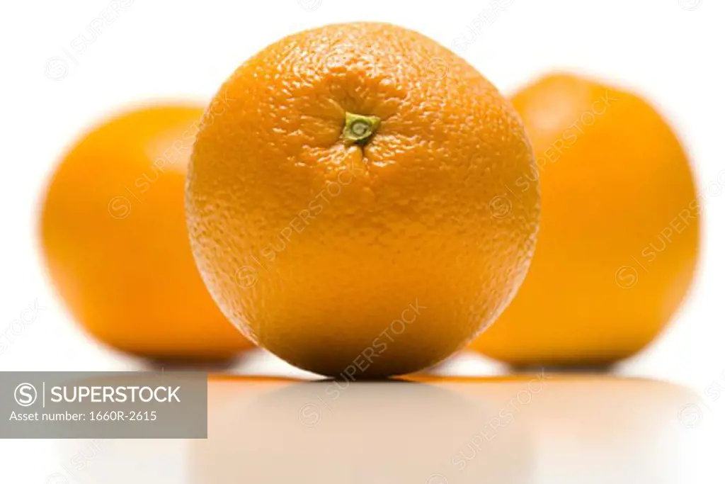 Close-up of three oranges (citrus sinensis)