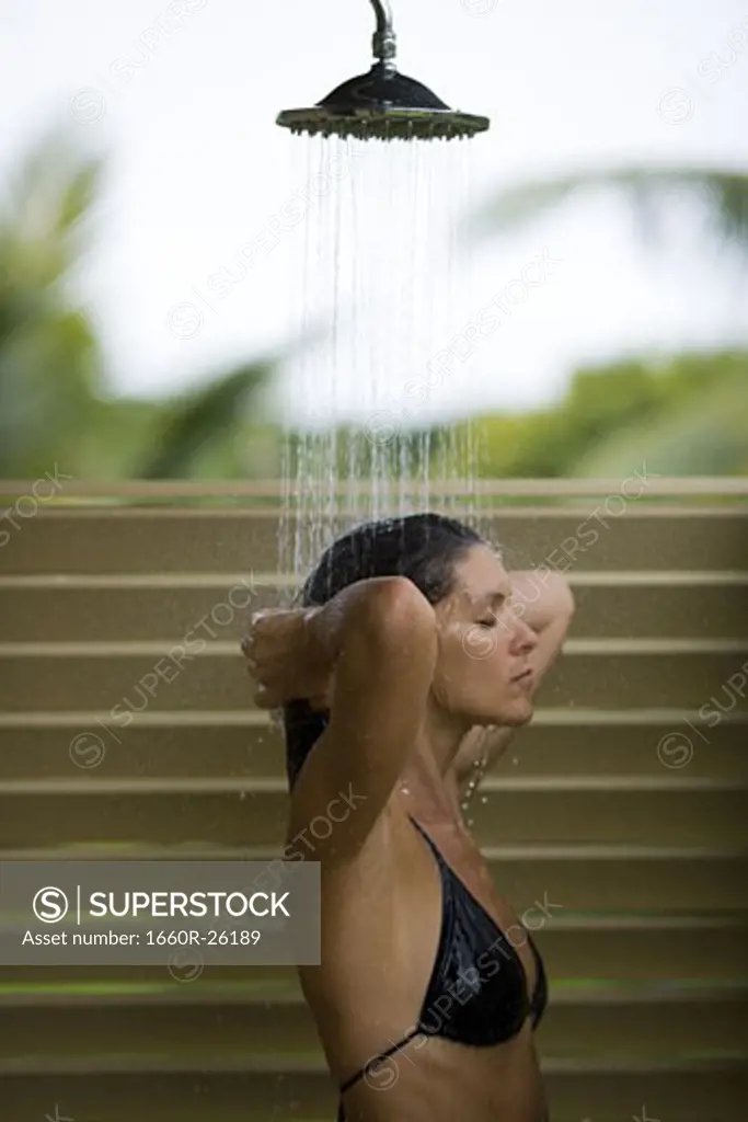 Profile of an adult woman taking a shower