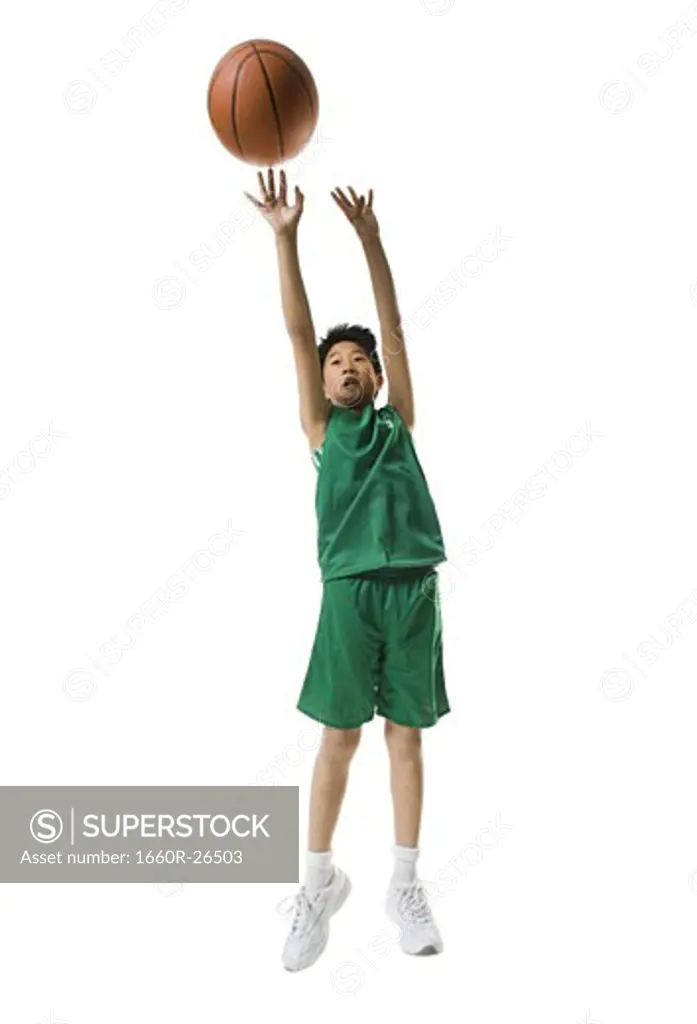 Boy throwing a basketball