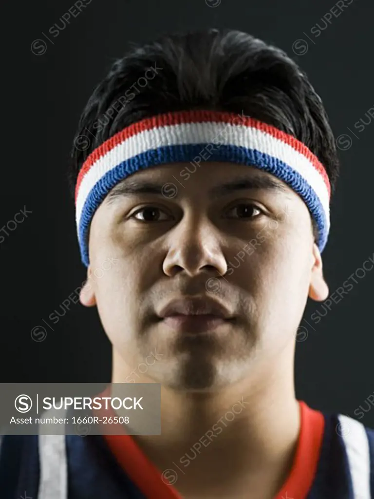 Portrait of a young man in a basketball jersey