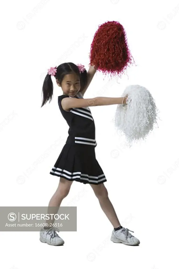 Portrait of a cheerleader dancing with pom-poms