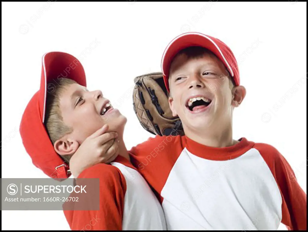 Close-up of two baseball players smiling