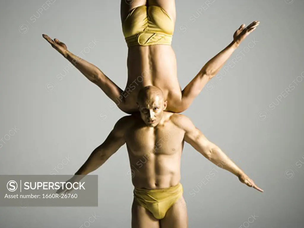 Two male acrobats performing