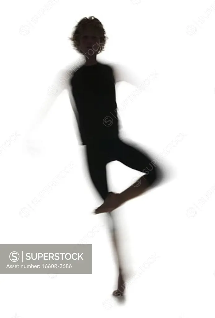 Silhouette of a young man performing ballet