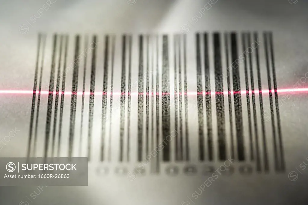 Close-up of a bar code being scanned with a laser light