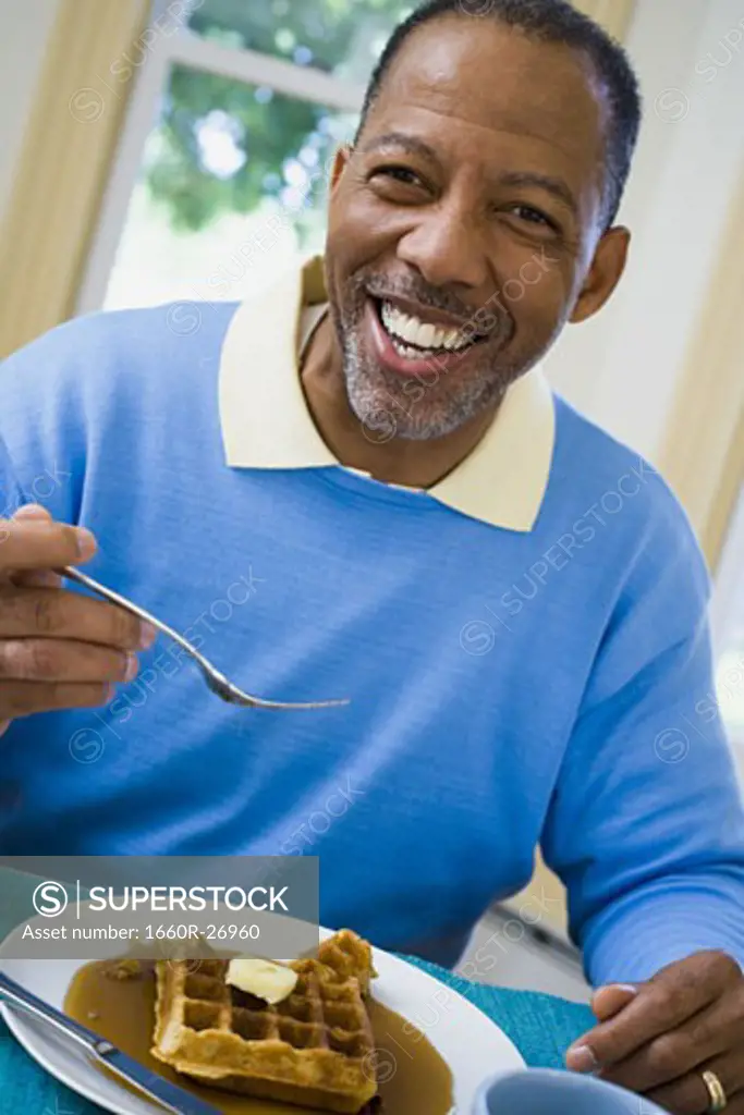 Portrait of a senior man having breakfast
