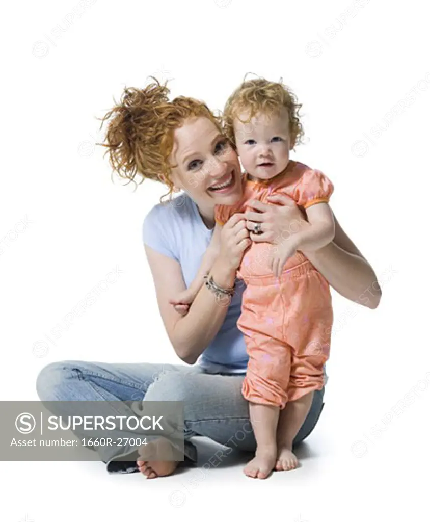 Portrait of a young woman and her daughter smiling