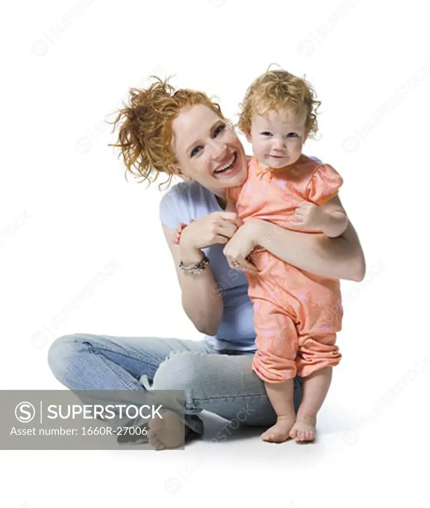 Portrait of a young woman and her daughter smiling