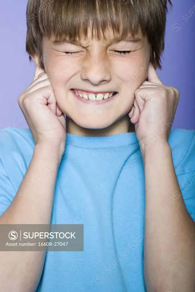 Close-up of a boy making a face