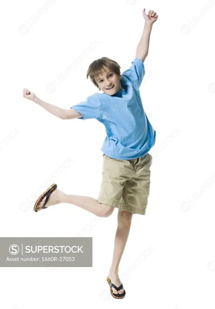 Portrait of a boy jumping with joy