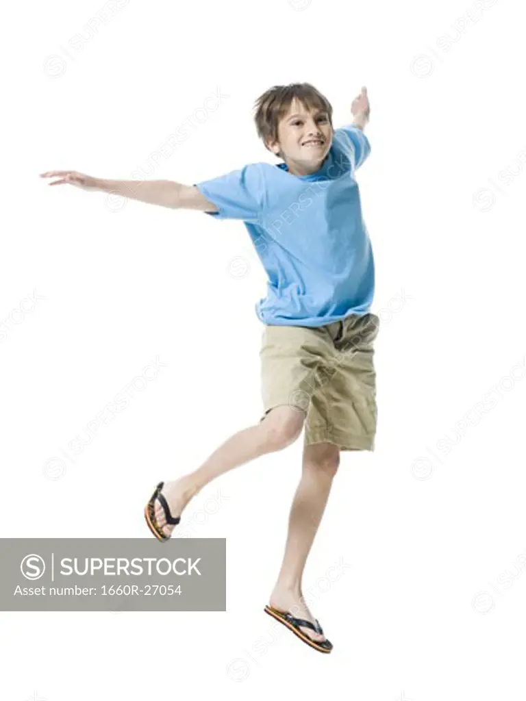 Portrait of a boy jumping with joy