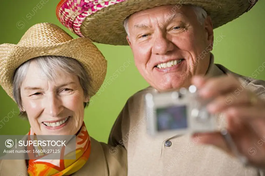 Close-up of an elderly couple taking a photograph of themselves