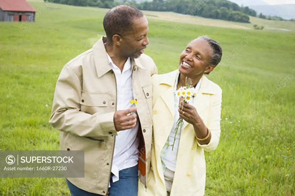 Close-up of a senior man and a senior woman smiling