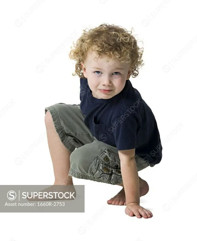 Portrait of a boy crouching