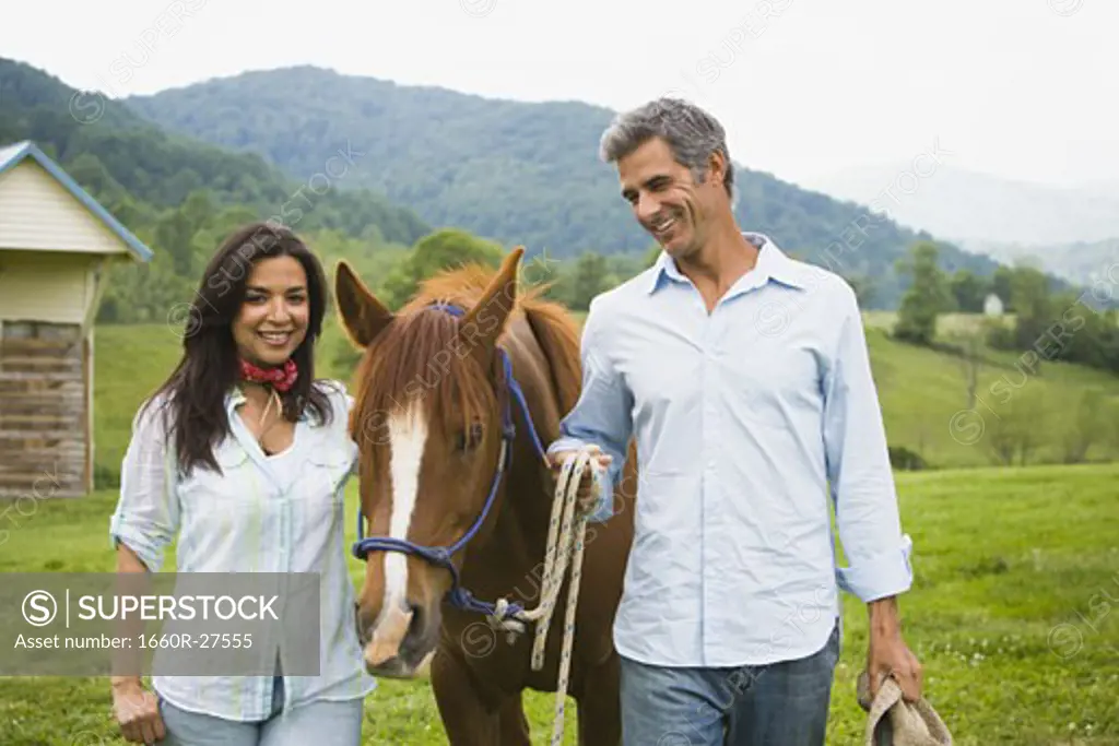man and a woman with a horse