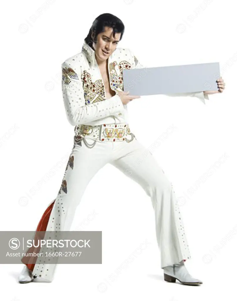 Portrait of an Elvis impersonator holding a blank sign