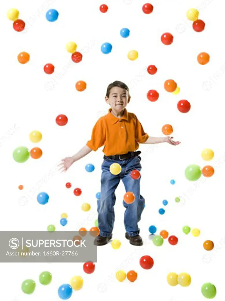 Boy playing with colored balls