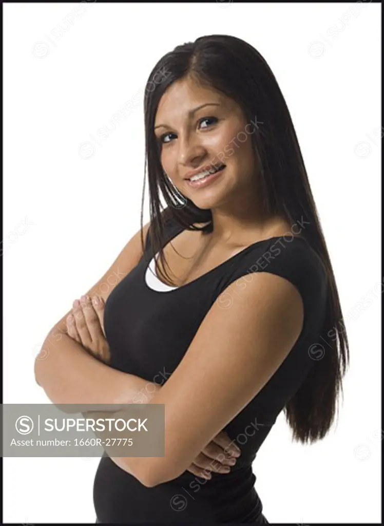 Portrait of a teenage girl with her arms crossed